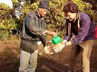 Stephan washing his hands with the help of Michael