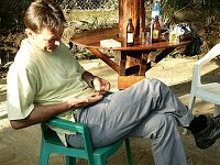 Counting his Tanzanian Shillings